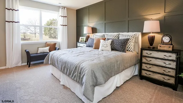 a bed room with a bed and a chair