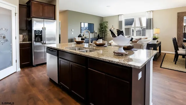 a kitchen with center island and sink