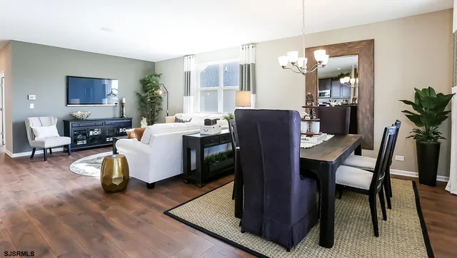 a living room with furniture rug and lamp
