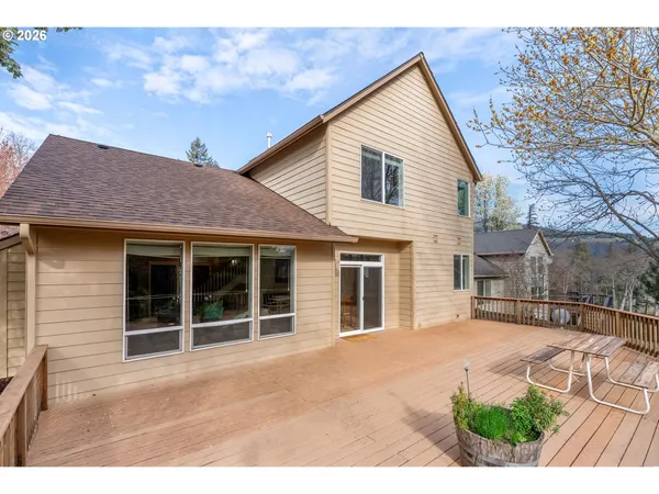 a view of a house with a yard and garage