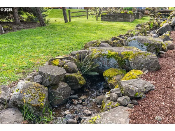 a backyard of a house with lots of green space