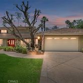 a view of a house with a yard and garage