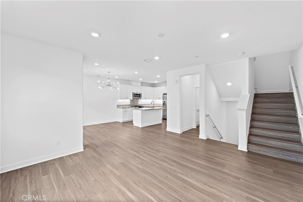 235 Carmona Lake Forest, CA 92630 - Photo 4 of 21 a view of kitchen with wooden floor and electronic appliances