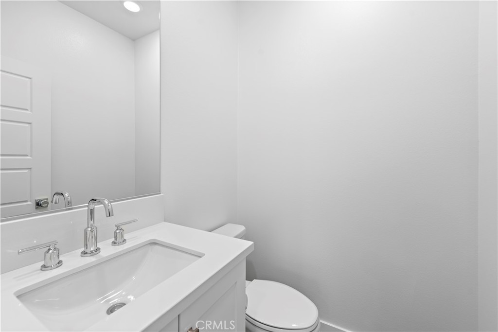 235 Carmona Lake Forest, CA 92630 - Photo 9 of 21 a bathroom with a sink and a toilet