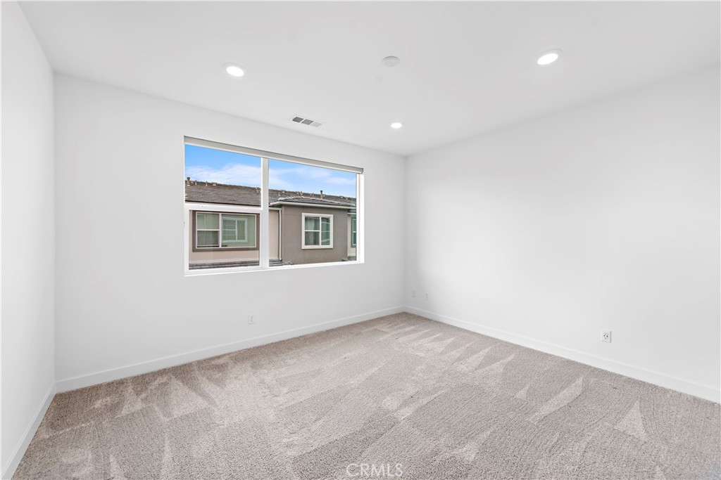 235 Carmona Lake Forest, CA 92630 - Photo 10 of 21 a view of an empty room with a window
