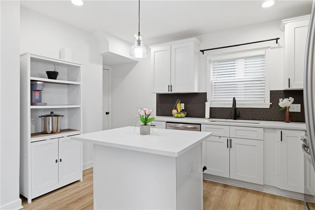 1535 Vance Avenue Coraopolis, PA 15108 - Photo 16 of 38 a kitchen with white cabinets and white appliances