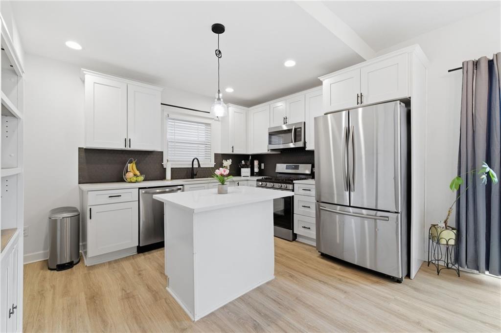 1535 Vance Avenue Coraopolis, PA 15108 - Photo 18 of 38 a kitchen with a refrigerator cabinets and wooden floor