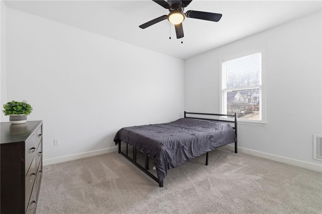 1535 Vance Avenue Coraopolis, PA 15108 - Photo 22 of 38 a spacious bedroom with a bed and a window