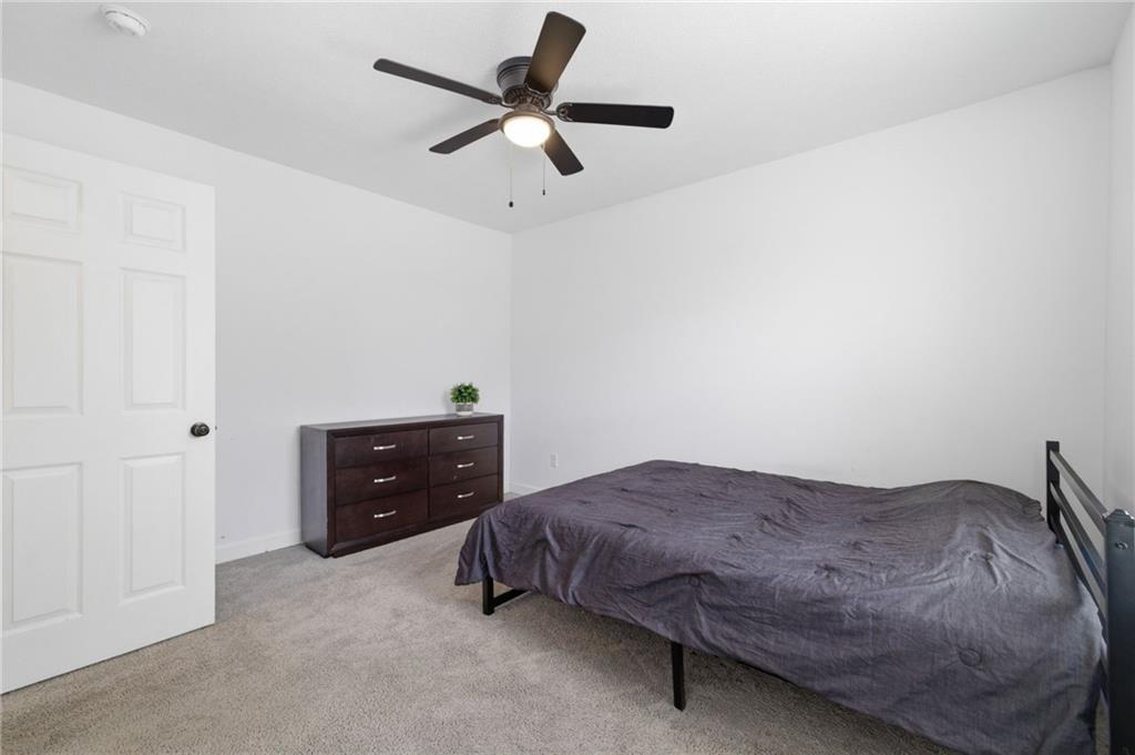 1535 Vance Avenue Coraopolis, PA 15108 - Photo 23 of 38 a bedroom with a bed and a ceiling fan