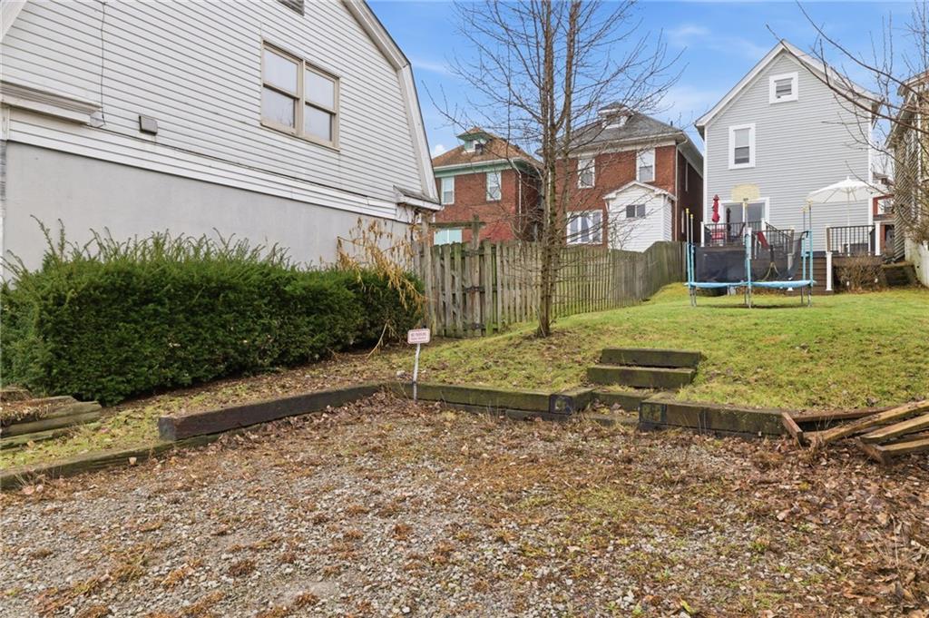 1535 Vance Avenue Coraopolis, PA 15108 - Photo 38 of 38 a view of a big house with a yard and large tree