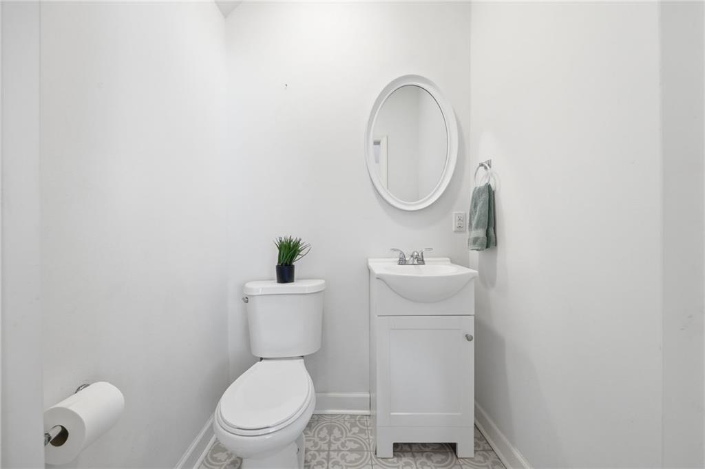 1535 Vance Avenue Coraopolis, PA 15108 - Photo 5 of 38 a bathroom with a toilet sink and mirror