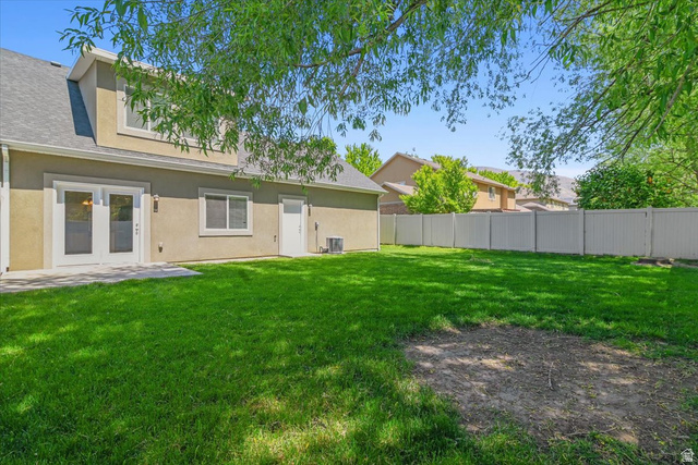 847 225 South Springville, UT 84663 - Photo 20 of 23 Expansive green lawn with a white privacy fence