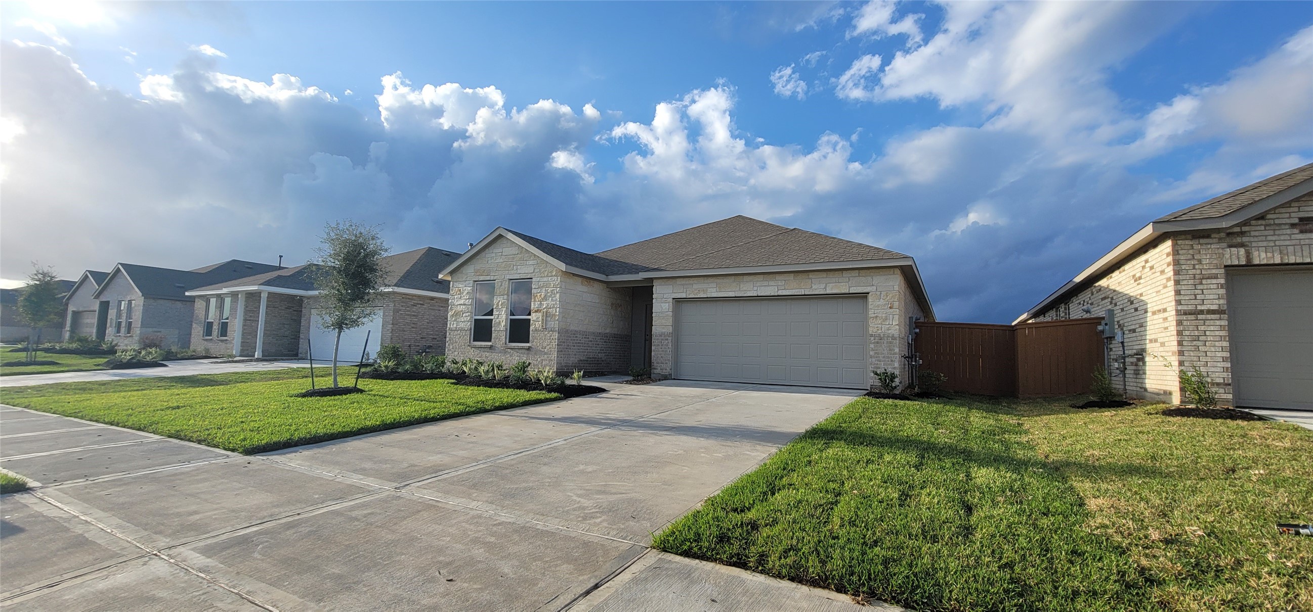 10615 Summers Way Beasley, TX 77417 - Photo 13 of 19 a front view of a house with a yard and garage