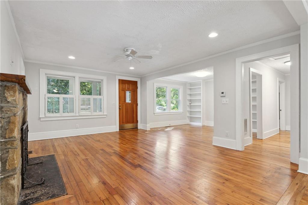 385 Sunset Drive Athens, GA 30606 - Photo 13 of 48 a view of an empty room with wooden floor and a window