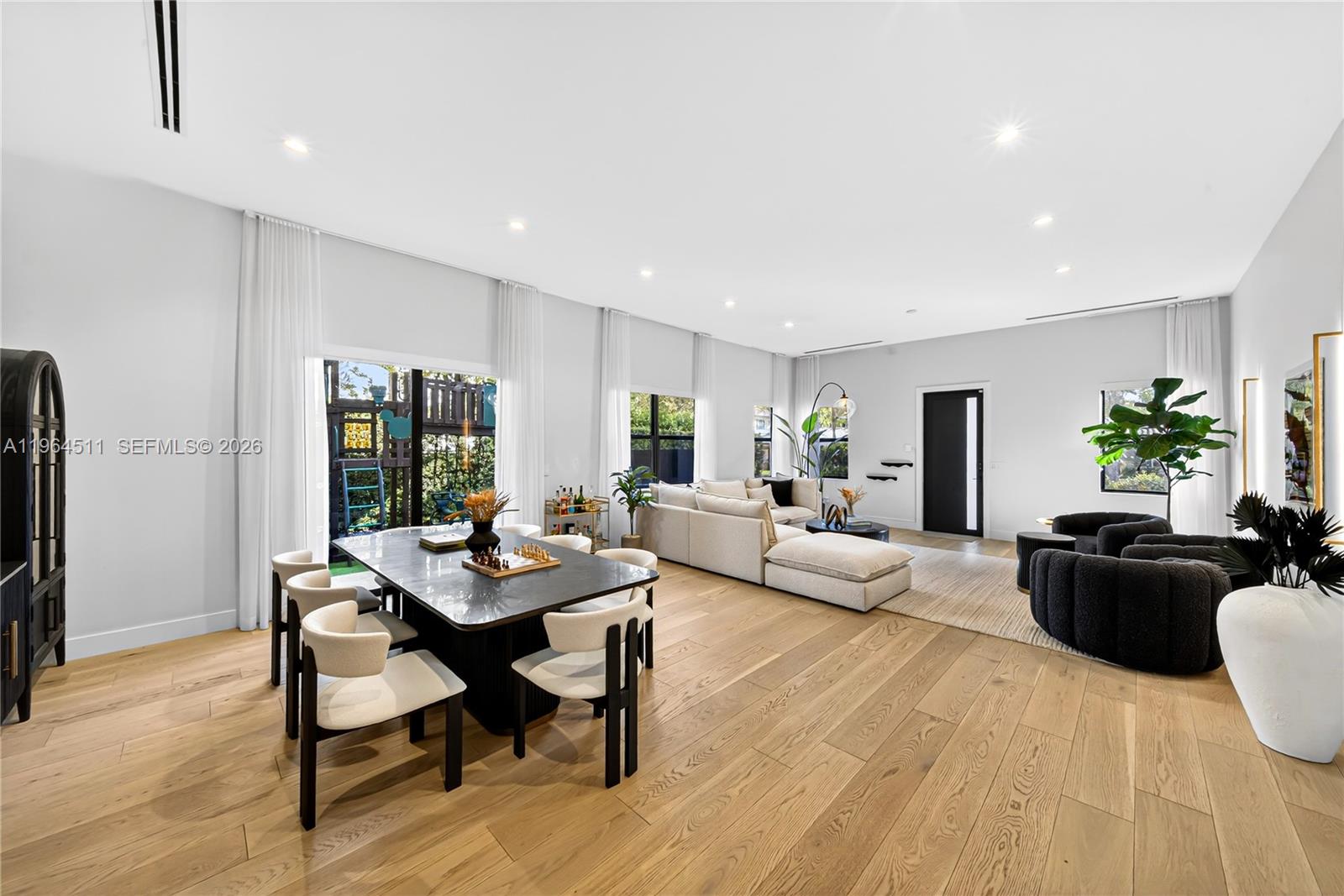 7500 Southwest 55th Avenue Miami, FL 33143 - Photo 5 of 48 a living room with furniture and wooden floor