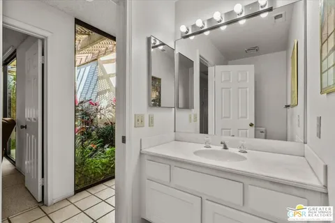 a bathroom with a sink and mirror