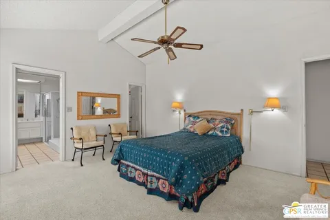 a bedroom with a bed and ceiling fan