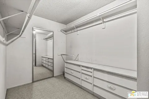 a view of an empty walk in closet