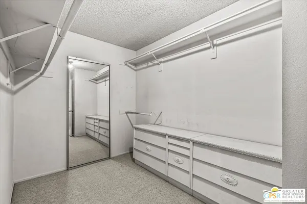 a view of an empty walk in closet