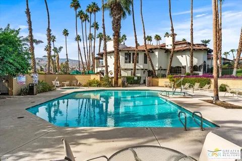 a view of a brick building with a yard