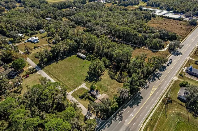 an aerial view of residential house with outdoor space
