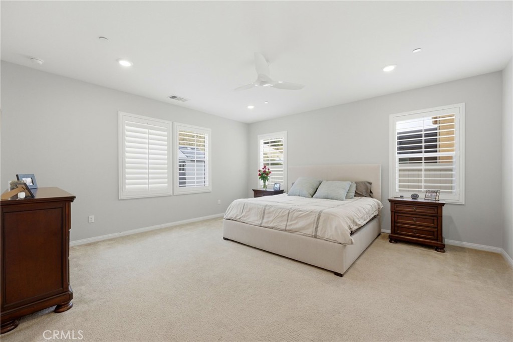 20948 Center Street Riverside, CA 92507 - Photo 48 of 92 a spacious bedroom with a bed and a window