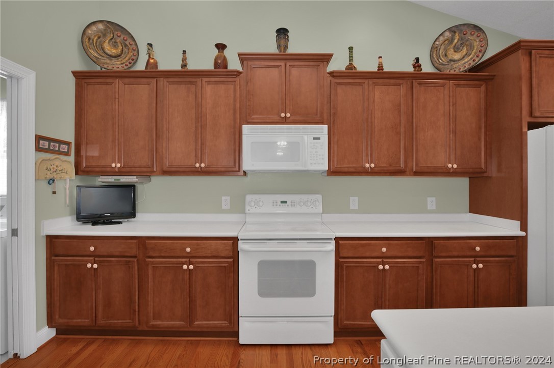 10703 Aberdeen Road Aberdeen, NC 28315 - Photo 11 of 33 a kitchen with cabinets and appliances