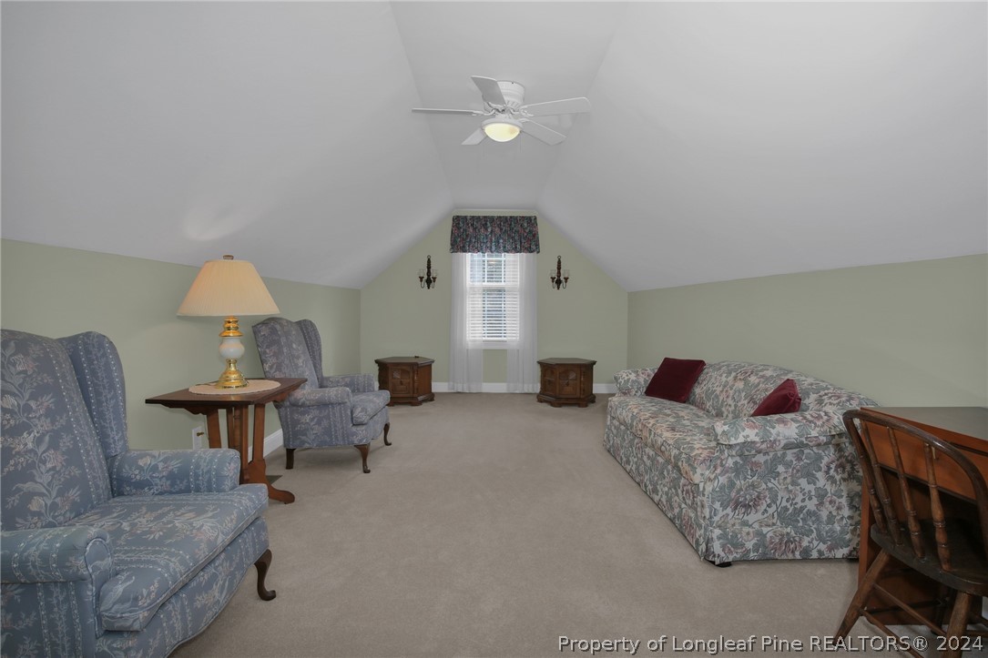 10703 Aberdeen Road Aberdeen, NC 28315 - Photo 27 of 33 a living room with furniture and a table