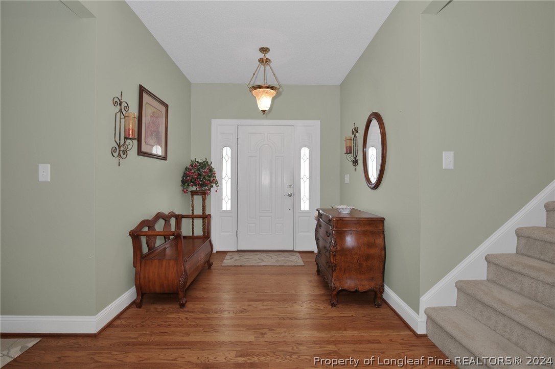 10703 Aberdeen Road Aberdeen, NC 28315 - Photo 4 of 33 a view of an entryway with wooden floor