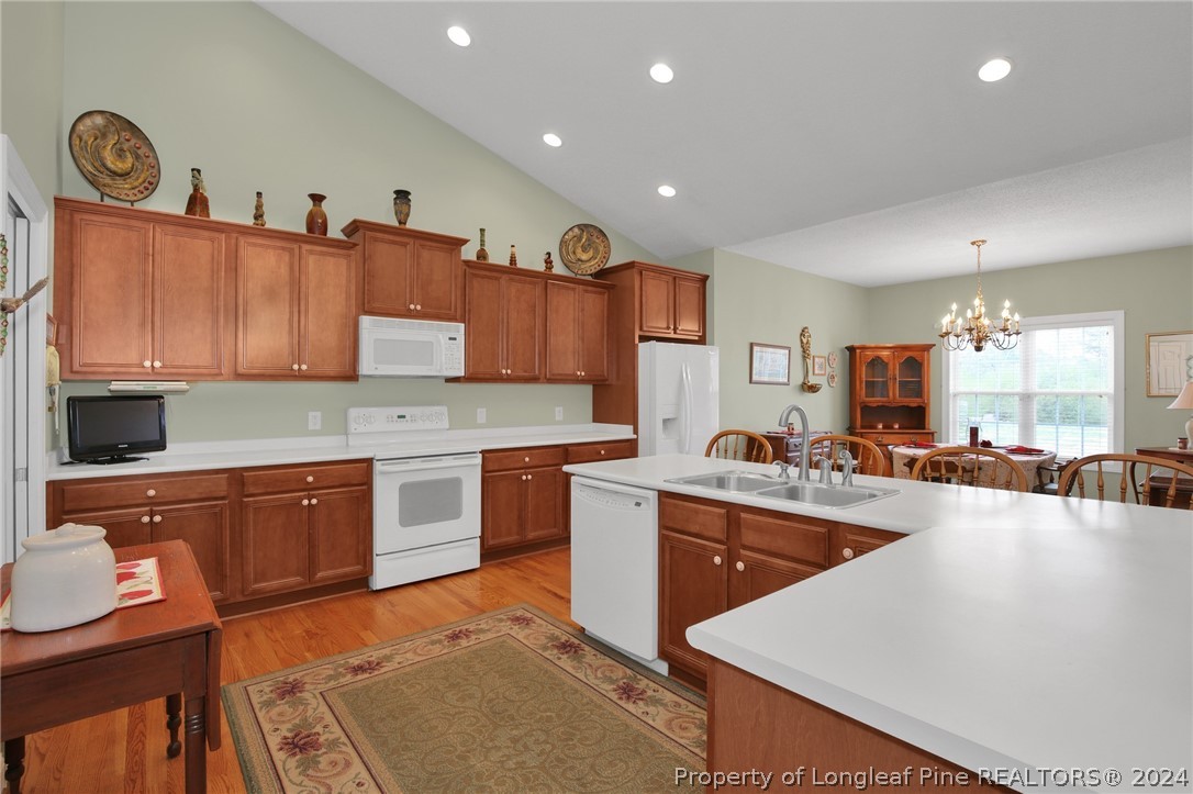 10703 Aberdeen Road Aberdeen, NC 28315 - Photo 10 of 33 a large kitchen with stainless steel appliances granite countertop a lot of counter space and a sink