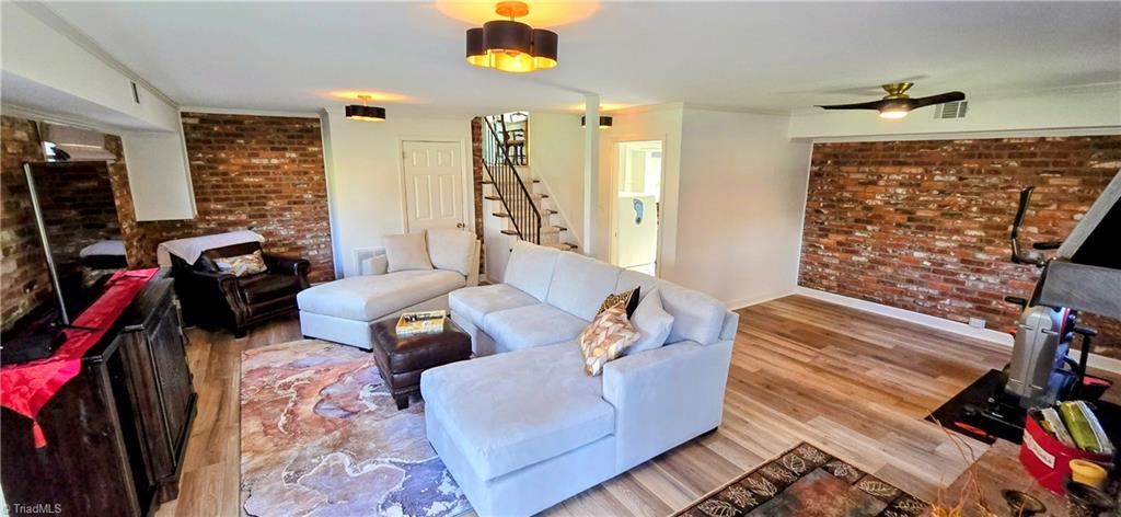 105 Mendenhall Road Jamestown, NC 27282 - Photo 16 of 42 New LVP flooring and lighting in lower level