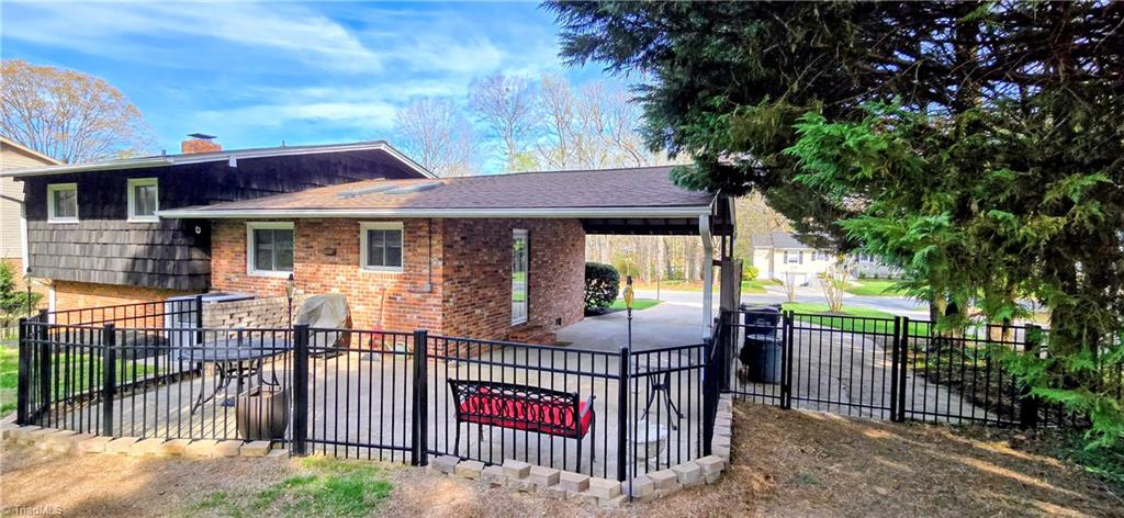 105 Mendenhall Road Jamestown, NC 27282 - Photo 24 of 42 Rear view of this well cared for home. Roof 2012, gas pack 2017