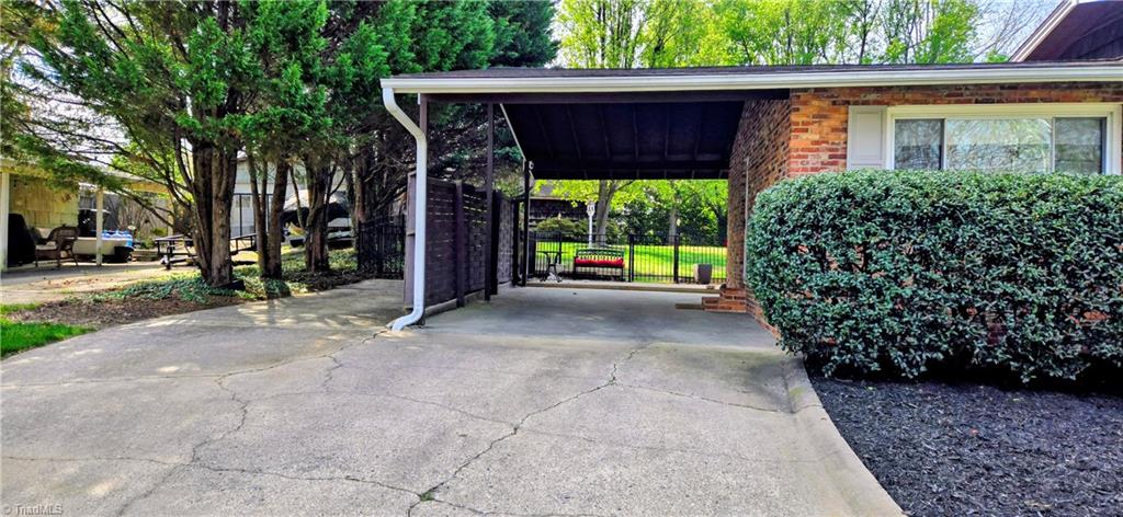 105 Mendenhall Road Jamestown, NC 27282 - Photo 26 of 42 One car carport and additional parking zone