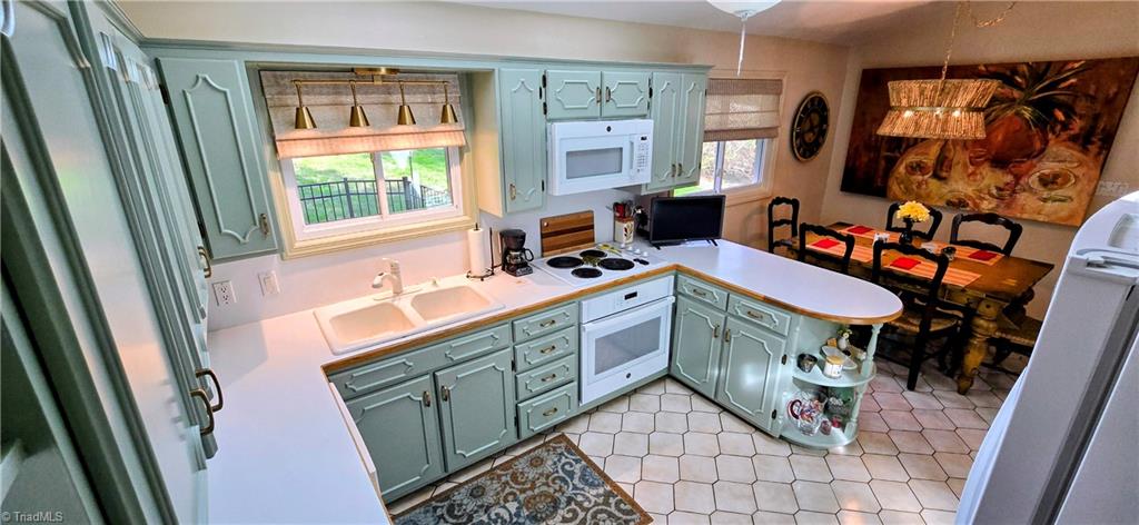 105 Mendenhall Road Jamestown, NC 27282 - Photo 3 of 42 Open kitchen/dining concept - new lighting in kitchen