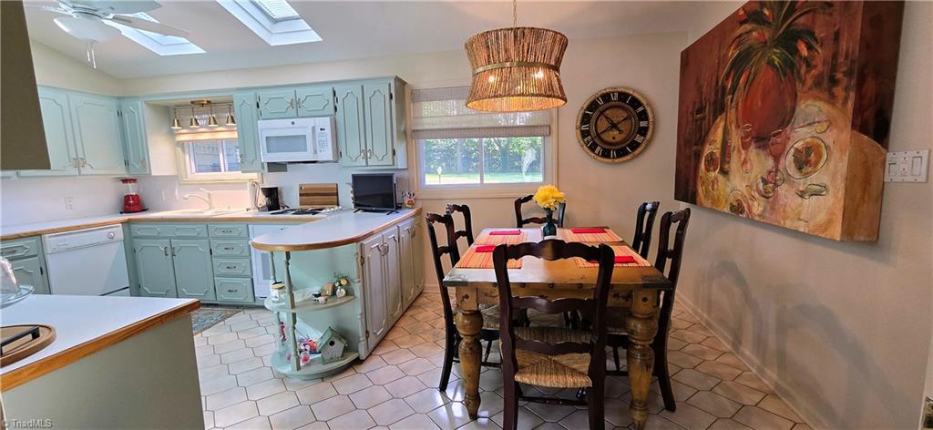 105 Mendenhall Road Jamestown, NC 27282 - Photo 5 of 42 New lighting in dining - fresh paint throughout kitchen and dining