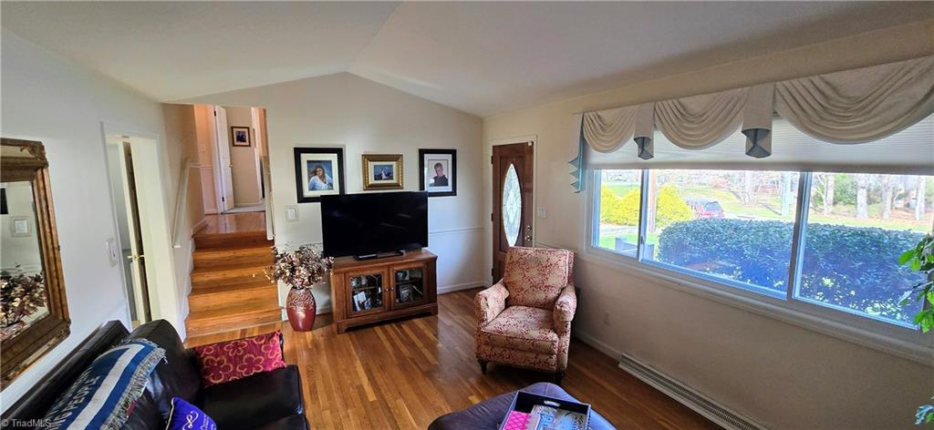 105 Mendenhall Road Jamestown, NC 27282 - Photo 8 of 42 Vaulted living room - the wood floors have been covered with carpet since home was built and have just been exposed in the past 5 years