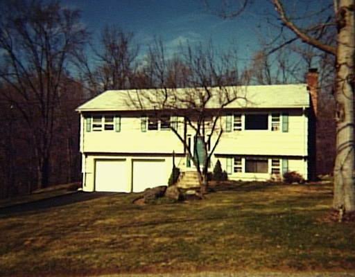 7 Royal Road Danbury, CT 06811 - Photo 1 of 1 a view of a large white house with a large tree next to a yard