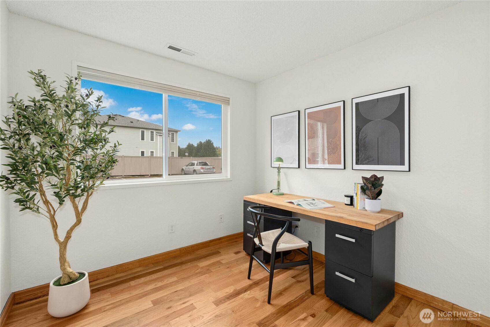 9523 Northeast 180th Street, Unit A102 Bothell, WA 98011 - Photo 17 of 29 a room with furniture and a potted plant