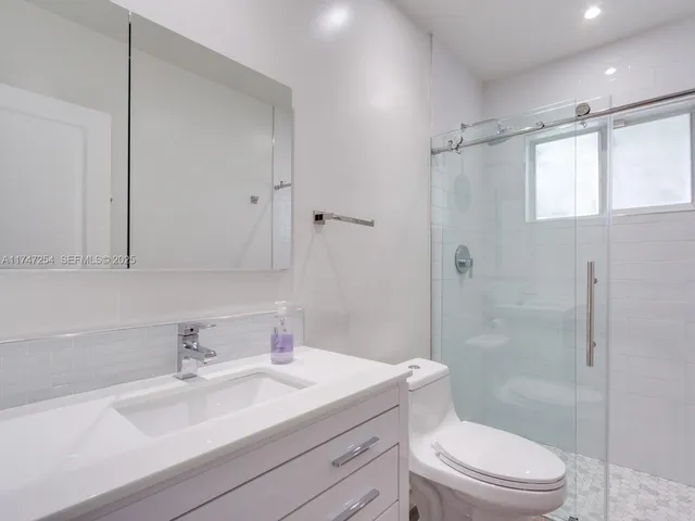 a outdoor living space with patio furniture and a large window