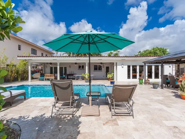 a view of swimming pool with outdoor seating