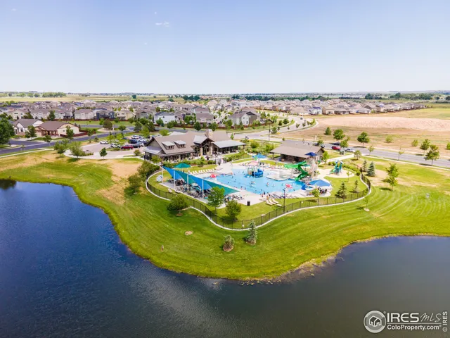 an aerial view of residential building and ocean view