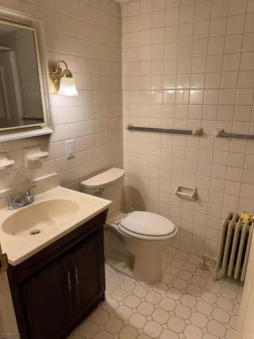 a bathroom with a sink toilet and vanity