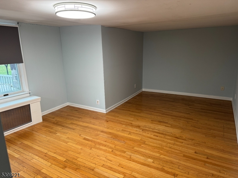 656 Highway 12, Unit 4 Flemington, NJ 08822 - Photo 5 of 16 a view of empty room with wooden floor