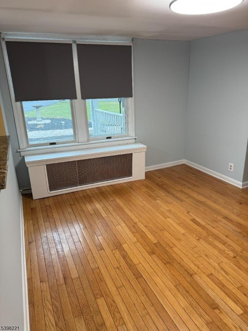 656 Highway 12, Unit 4 Flemington, NJ 08822 - Photo 7 of 16 a view of room with window and wooden floor