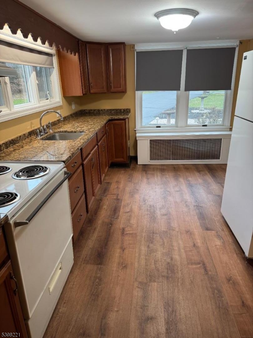 656 Highway 12, Unit 4 Flemington, NJ 08822 - Photo 8 of 16 a kitchen with a stove a sink and a refrigerator