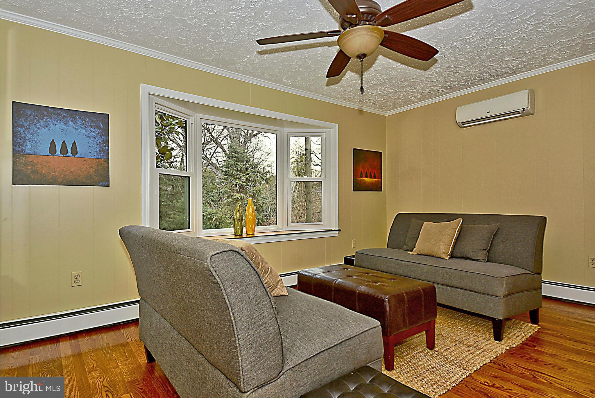 1111 Woodside Parkway Silver Spring, MD 20910 - Photo 13 of 30 a living room with furniture and a window