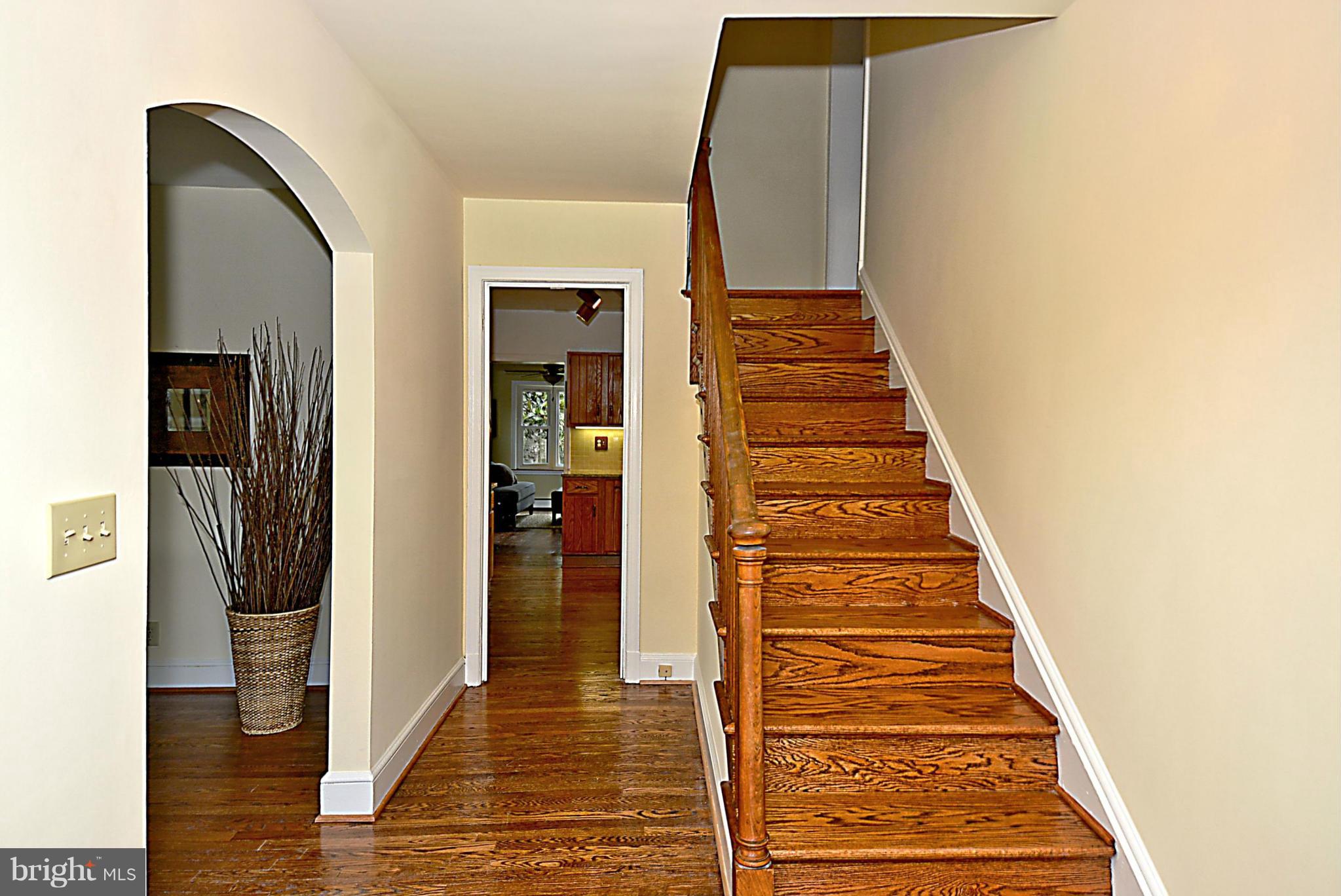 1111 Woodside Parkway Silver Spring, MD 20910 - Photo 3 of 30 a view of a hallway with wooden floor and entryway