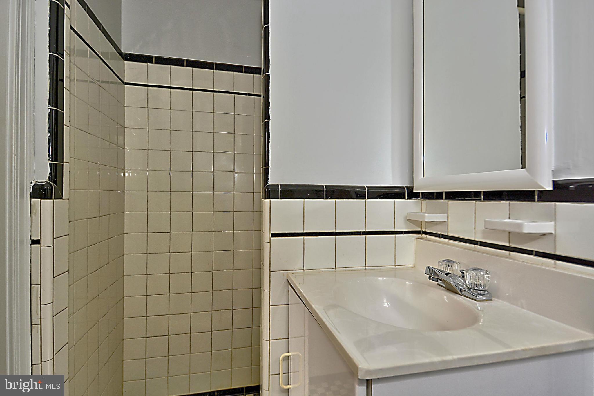 1111 Woodside Parkway Silver Spring, MD 20910 - Photo 21 of 30 a bathroom with a sink and a shower