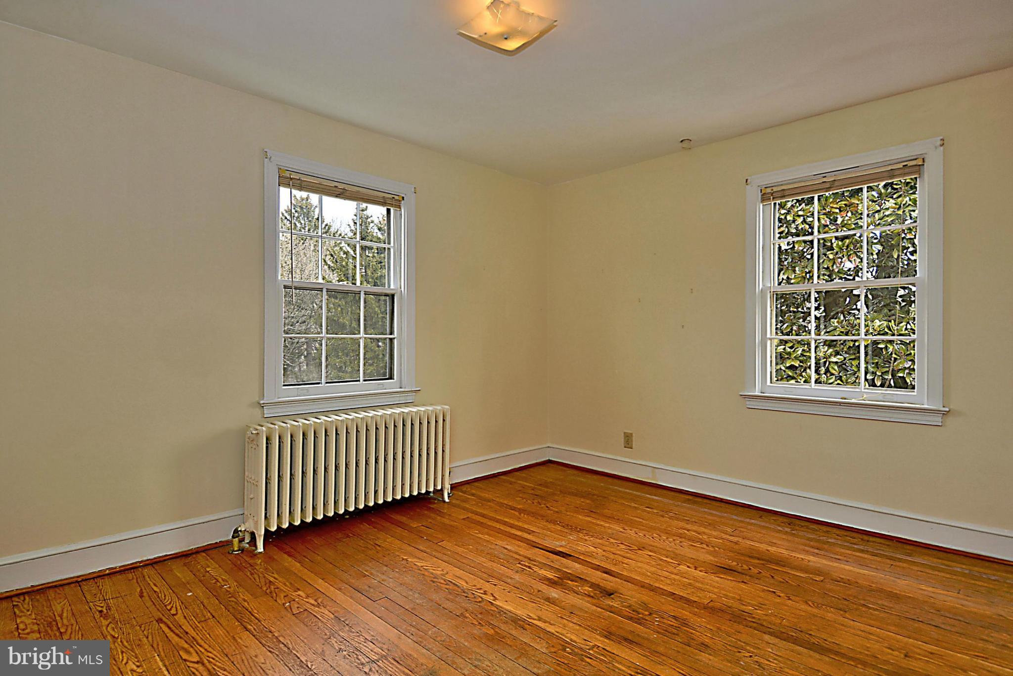 1111 Woodside Parkway Silver Spring, MD 20910 - Photo 23 of 30 an empty room with wooden floor and windows