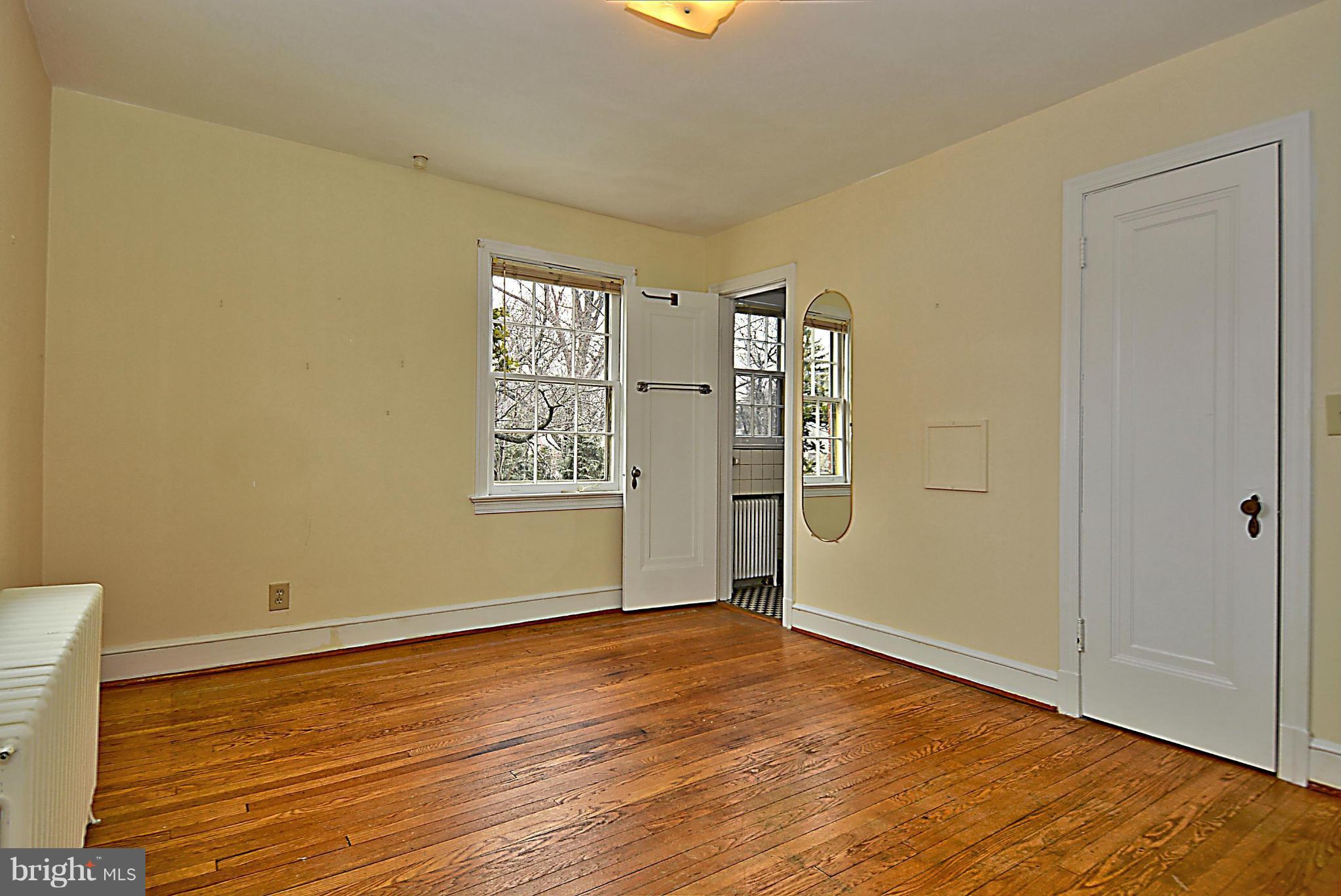 1111 Woodside Parkway Silver Spring, MD 20910 - Photo 24 of 30 an empty room with wooden floor and windows